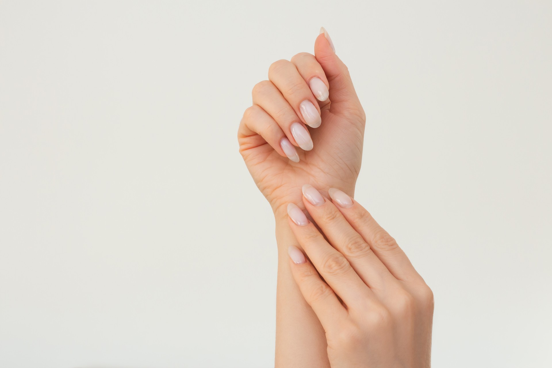 shot of women's well-groomed hands gently touching each other with a beautiful manicure Beauty and body care